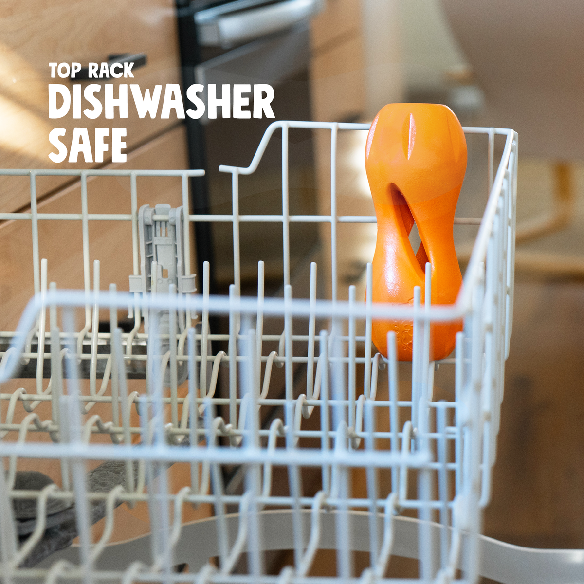 Tangerine Qwizl in the top rack of a dishwasher