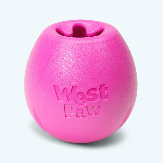 Hot pink West Paw Rumbl treat-dispensing puzzle toy