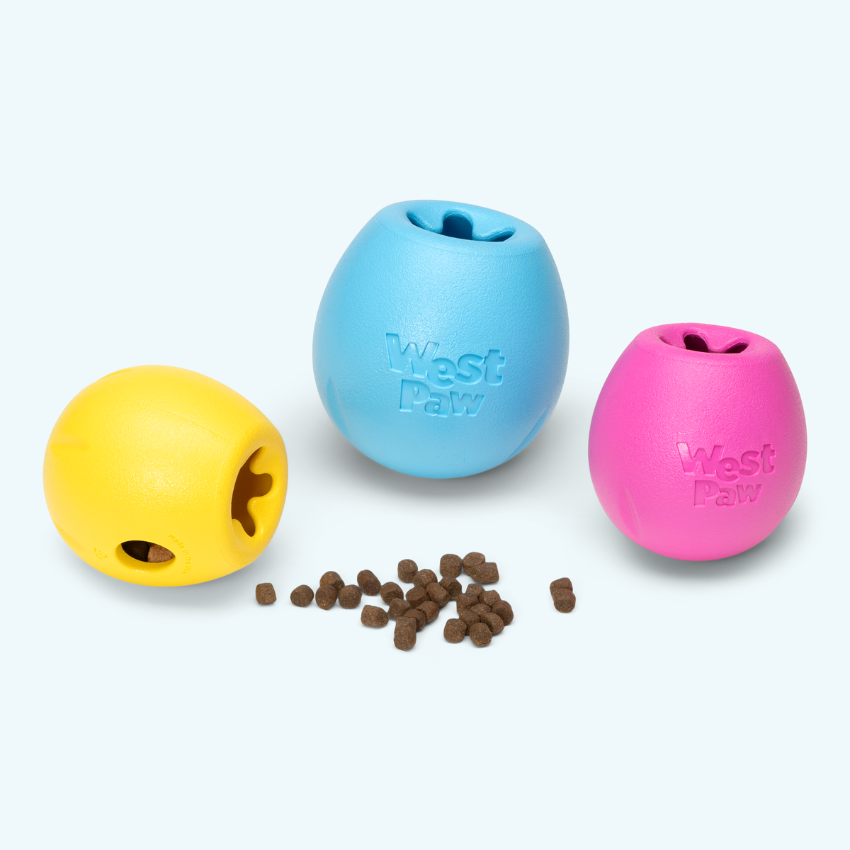 West Paw Rumbl toys in dandelion, aqua and hot pink with kibble