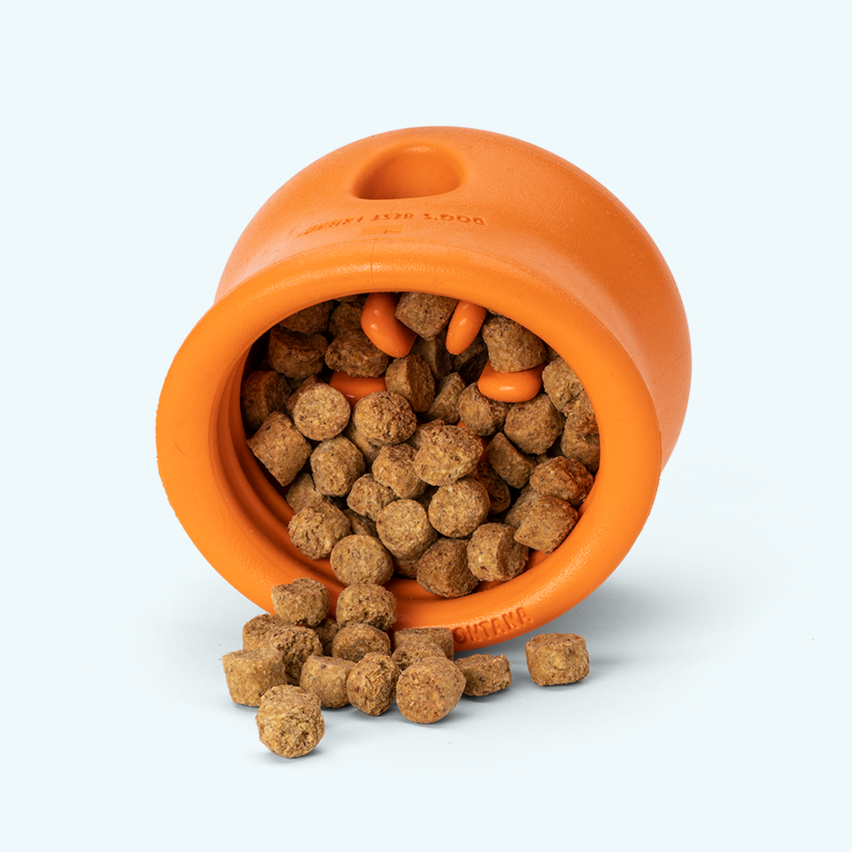Tangerine Toppl tipped over with kibble inside