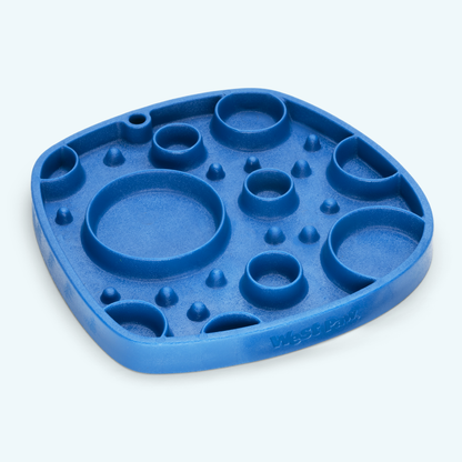 Blue West Paw Bubbles Feast Mat showing the slow-feeder side on a light background.